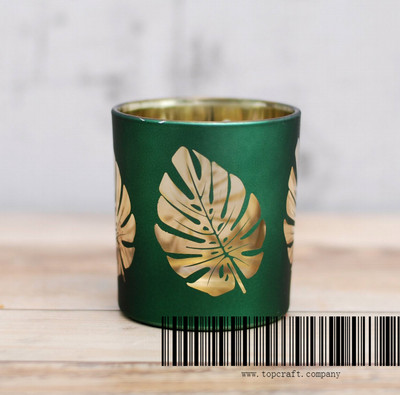 Glass candle cup with decal.