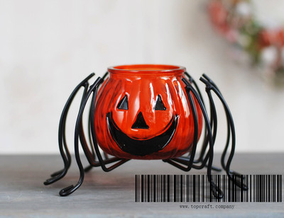 Glass pumpkin spider candle holder.