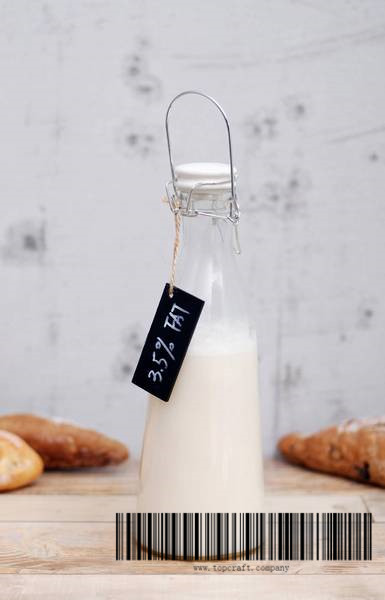 1000ml Glass milk bottle with ceramic lid and wooden chalkboard.